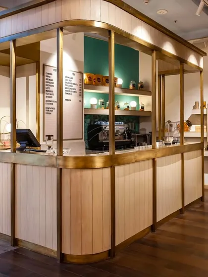 A wider view of the coffee counter, designed to be open and inviting, showcasing our commitment to quality brews in a stylish setting.