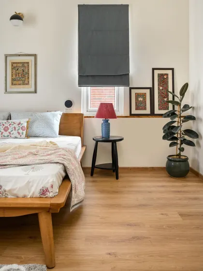 This corner of the 'House of Kismish' daughter's bedroom is decorated with traditional Indian art, adding a personal and cultural touch to the modern design.