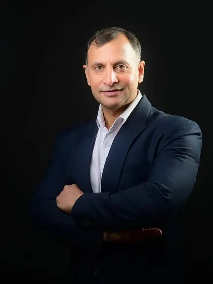 A classic three-quarter portrait with arms crossed. This is a go-to shot for conveying leadership and a professional demeanor in any field.
