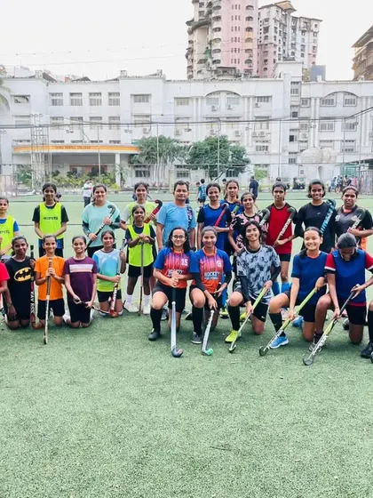 A full group photo of our girls' squad after a Saturday practice session. The team includes a wide range of ages, all training together to improve their game.