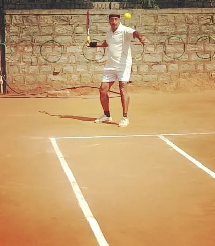A senior player demonstrates his technique during a UTR Tour match.