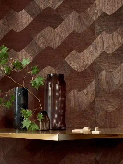 The wavy wood marquetry pattern creates a stunning feature wall. The interplay of light and shadow across the different wood grains adds a sense of movement and organic elegance.
