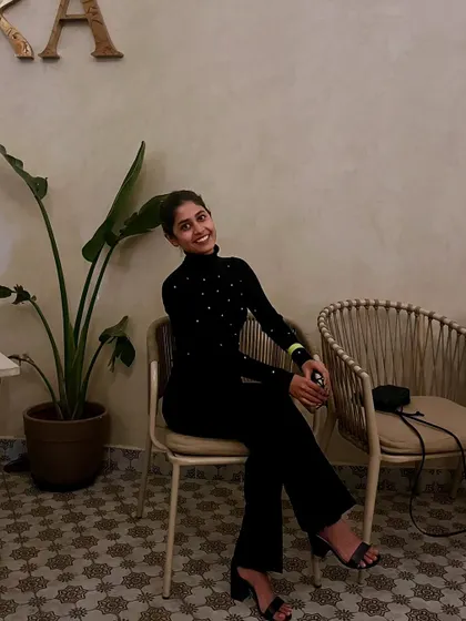 A candid photo of me enjoying a quiet moment. Behind all the high-energy dancing, I believe in finding art and joy in everyday life.