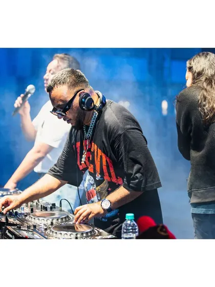 In the zone, scratching and mixing live at the Artist Connect Dance Music Festival. This is where I showcase my turntablism skills on a big stage.