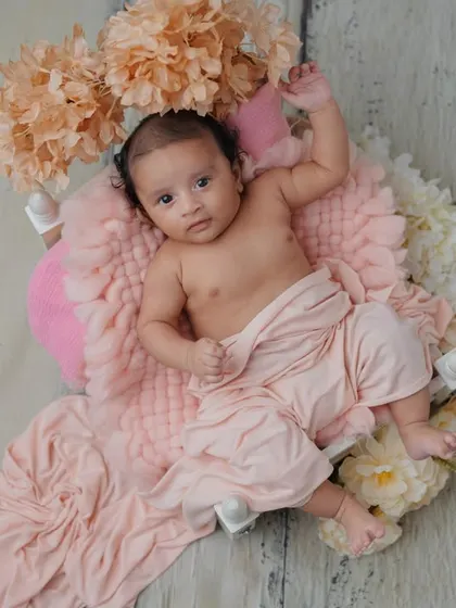 A little stretch and a curious look. I love capturing the full range of your baby's expressions, from sleepy to wide awake.