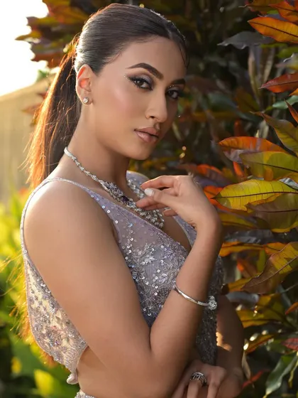 The classy and unstoppable look captured in natural light. The makeup remains flawless and impactful, showcasing its versatility.