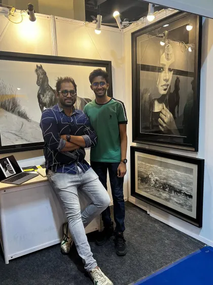 Posing with a young visitor at my exhibition booth.