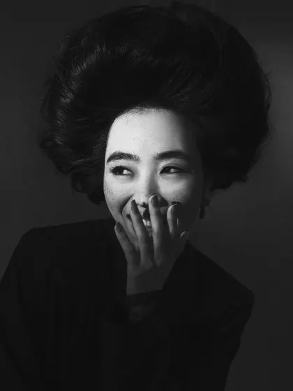 A candid, joyful black and white moment. This shows a different side of the model's personality, adding range and relatability to their portfolio.
