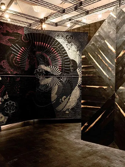 A repeat of image 83, showing the juxtaposition of woven and wooden panels in the 'Gothilicious' installation.