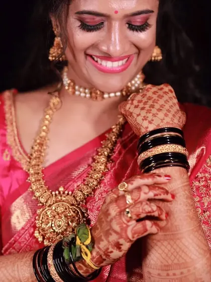 A joyful close-up of my client Nikitha on her wedding day, her smile is as bright as her beautiful outfit.