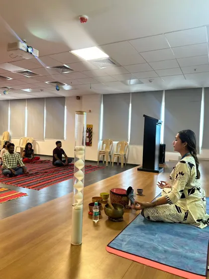 A side view of the session at Autoliv, showing the participants and my setup with the rainstick prominently featured. The sound of the rainstick is excellent for stress relief.