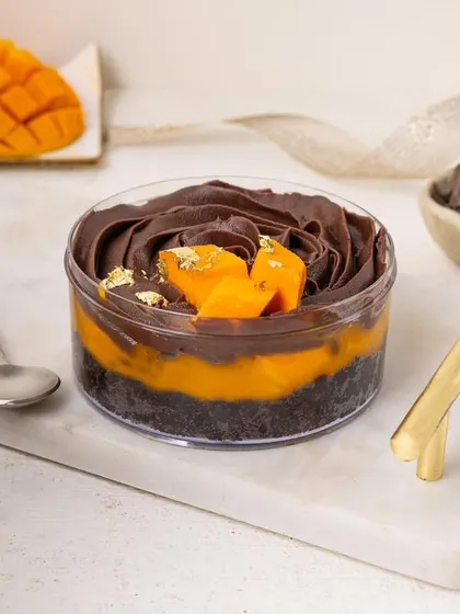 A decadent chocolate and mango tub dessert, combining rich and fruity flavors in one beautiful package.