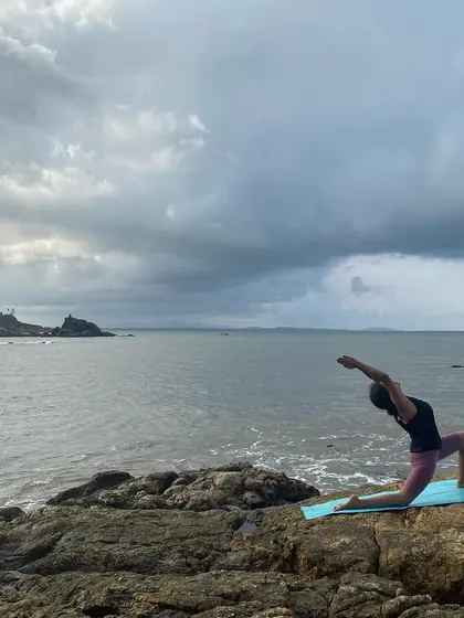 We love when our students take their practice on vacation. Here's a student in Anjaneyasana (Low Lunge) on the beach. It's a beautiful expression of how yoga becomes a part of your life.