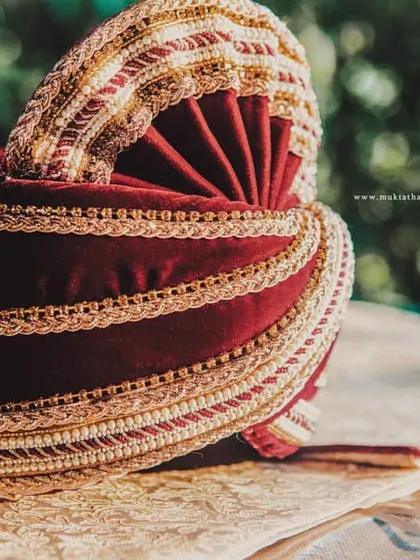 The groom's wedding turban, a symbol of honor and tradition, captured in beautiful detail.