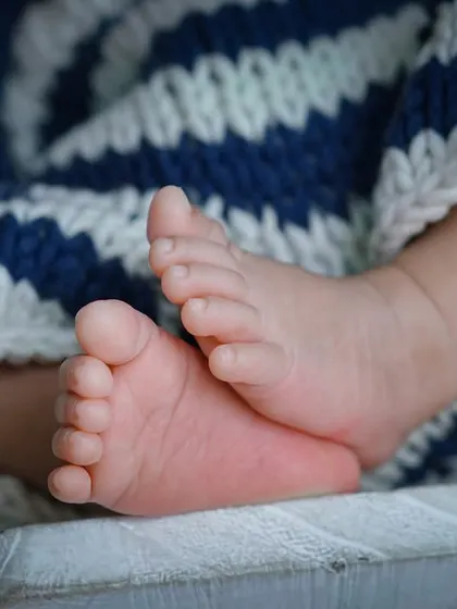 I am obsessed with all the tiny details. These perfect little feet, so small they fit in the palm of your hand, are the details I want you to remember long after they've grown.