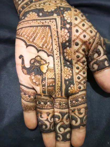 A close-up of a design with an elephant motif. Even a small part of the hand can tell a story with the right details.