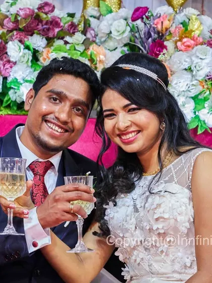 Cheers to the happy couple. This is a fun, classic reception shot that captures the celebratory mood of the evening.