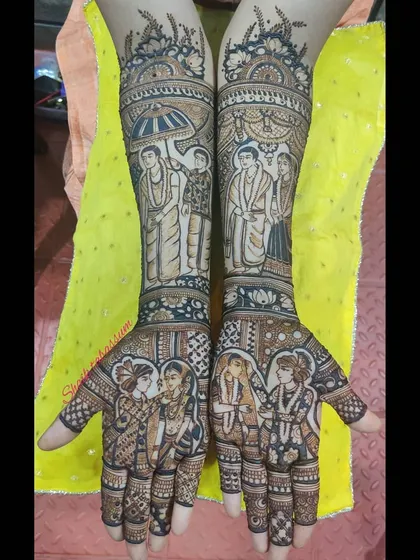 A depiction of a South Indian wedding ceremony in henna. The design showcases the couple in traditional attire, complete with specific rituals and portraits, making it a cherished memory.