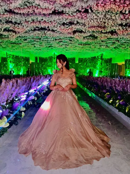 Another shot of the gorgeous champagne ball gown under magical lighting. The full flare and delicate embroidery make it a true fairytale dress.