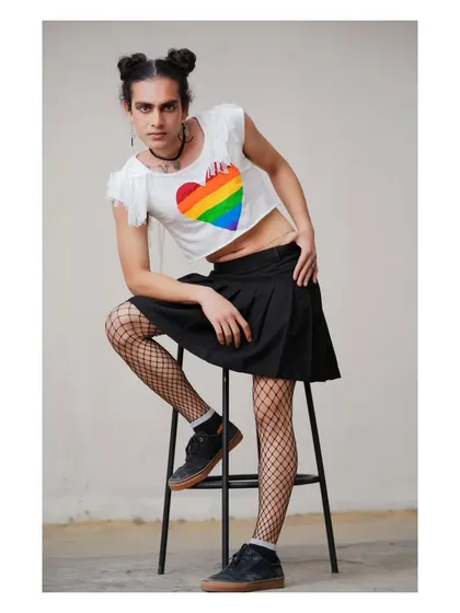 Another shot from the "Born This Way" series, this one celebrating gender-fluid expression with a rainbow heart and a confident pose.