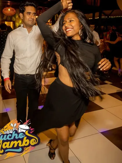 A candid moment of me enjoying a dance. I make it a point to dance with our students and guests, ensuring everyone feels part of the Palladium family.