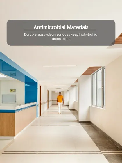 Antimicrobial materials are crucial in high-traffic hospital corridors. We specify durable, easy-clean surfaces to keep these areas safer and reduce the risk of infection, a key principle of our evidence-based design approach.
