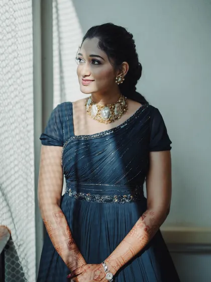 A portrait of Surabhi, showing her elegant gown and the beautiful choker necklace.