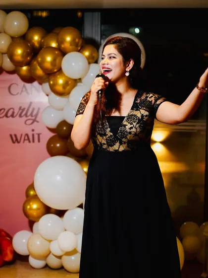 On stage at a 'We Can Bearly Wait' themed baby shower. The decor was adorable, and the atmosphere was full of love and anticipation.