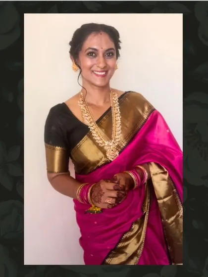 Anju in a classic pink and gold Kanjivaram, paired with a black blouse for a striking contrast.