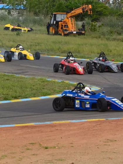 A pack of Formula LGB cars navigating a corner. Our program places drivers in the heart of the action to hone their racecraft.