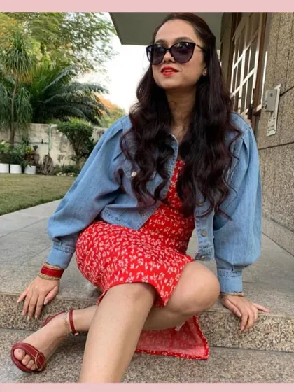 A denim jacket is the ultimate layering piece. Here, I've thrown a puff-sleeve denim jacket over a red floral dress to make it more casual and add a bit of warmth for a cooler day.