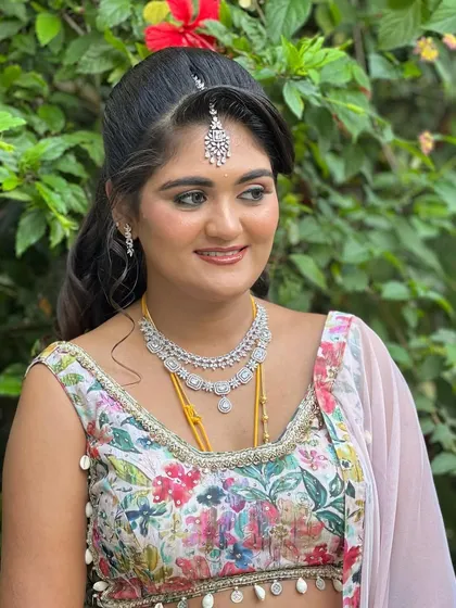Ashitha looking dreamy in a floral lehenga for her post-wedding event. I created a subtle, dewy makeup look with a focus on glowing skin to match the soft, romantic feel of her outfit.