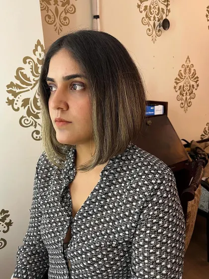 A high inverted bob for Arshiya, a versatile cut that works for both curly and straight hair.