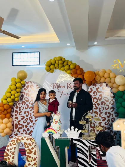 The family celebrating at the jungle-themed first birthday party. My decorations create a festive and memorable setting for your family photos.
