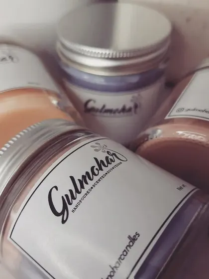 Another angle of the custom-labeled jar candles, showing the variety of colors available.