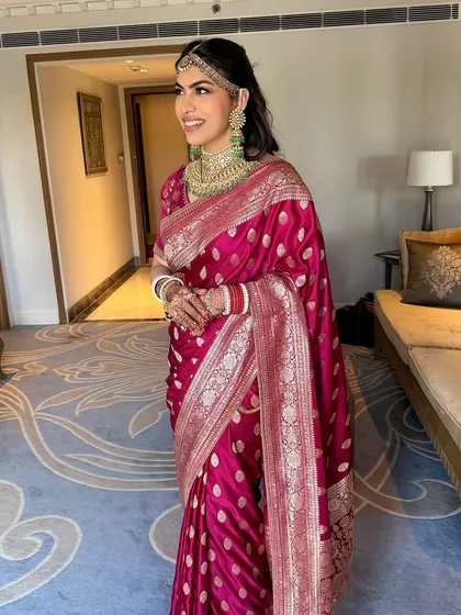 The picture of newlywed bliss. Varda's soft, rosy makeup and glowing skin create a look of pure happiness and effortless grace.