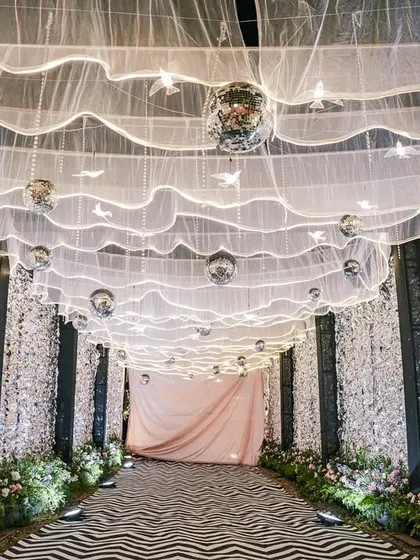 A straight-on view of the glamorous silver entrance tunnel, creating a sense of anticipation and excitement for the event ahead.