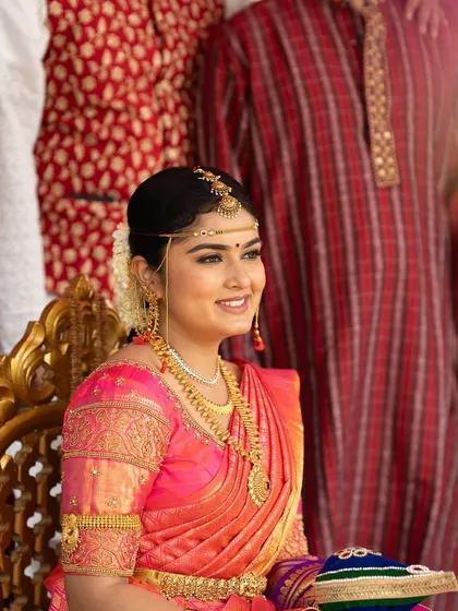 A happy moment captured on camera. The bride's smile is the best accessory, and my makeup ensures she feels confident enough to shine.