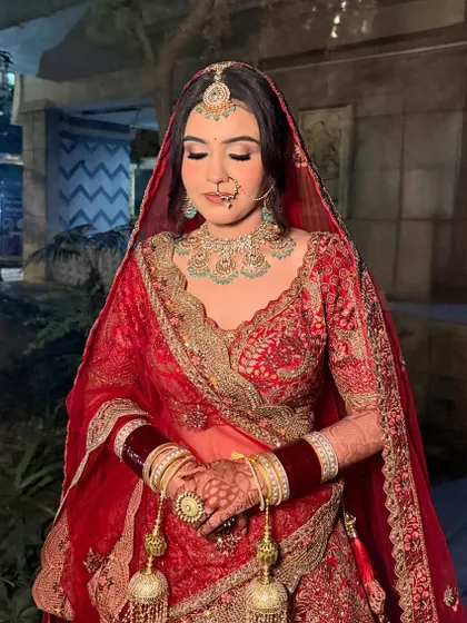 A final look at the bride. The soft contour and glowing highlight catch the light perfectly, making her skin look luminous.