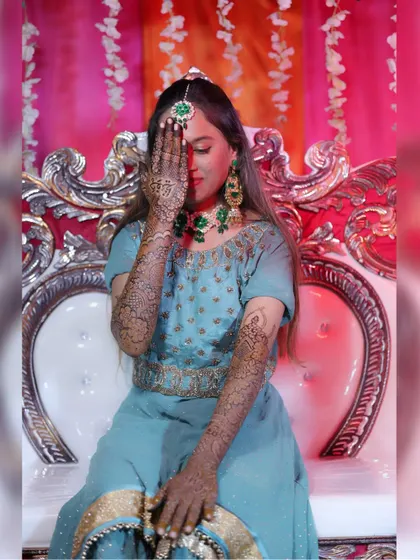 A classic bridal pose with the henna.