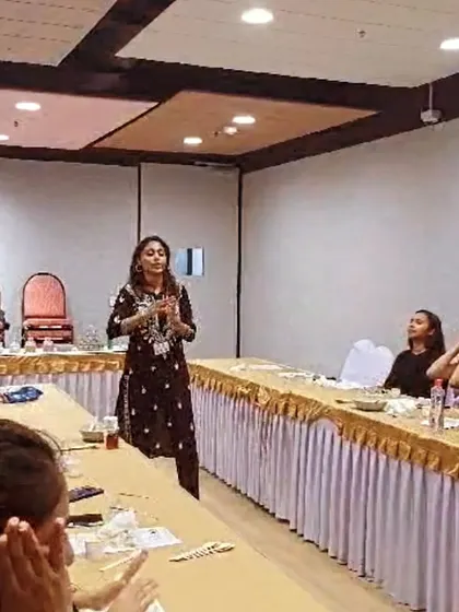 I'm leading a Face Yoga session at D.E. Shaw, explaining how simple facial exercises can release tension and promote a sense of well-being. These workshops are interactive and educational.