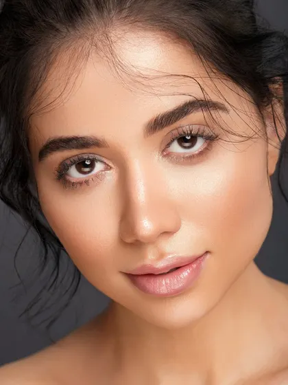 A close-up that highlights the model's clear eyes and natural features. This type of clean, honest portrait is essential for any model's book, showcasing their potential as a canvas.