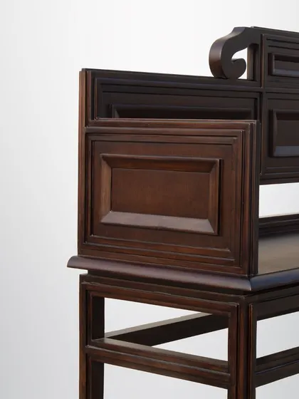 A detail of the vintage bench, showing the traditional joinery and carved details that make it a work of art.