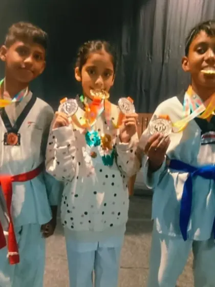 My champions biting their medals. A fun moment after winning gold and bronze at the state championship.
