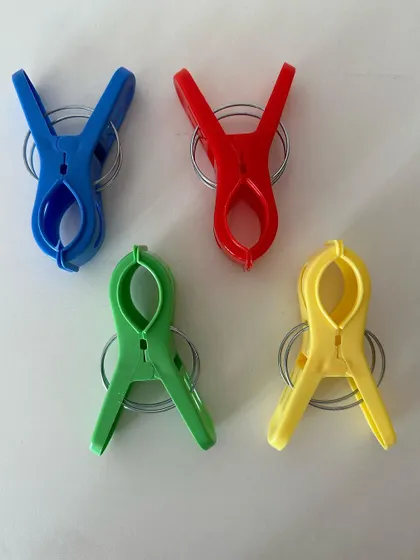 A close-up of the jumbo saree pegs from my draping kit. These are strong and broad, perfect for holding pleats of any saree fabric, from cotton to heavy silk.