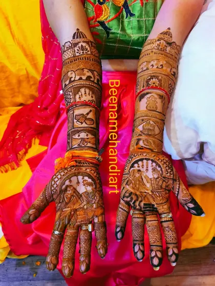 This full bridal mehandi tells the story of the wedding ceremony. The design includes portraits of the couple, family members, and auspicious wedding symbols.