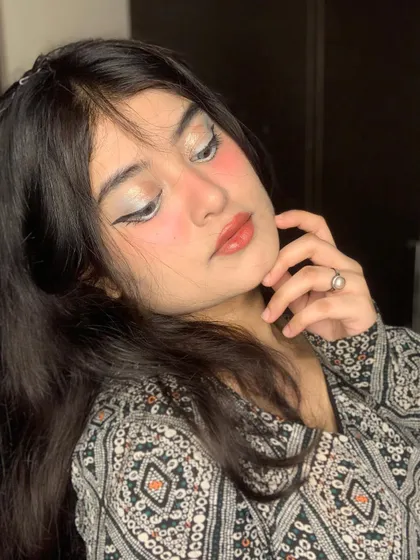 The full effect of the anime-inspired look with glossy lips and soft hair.