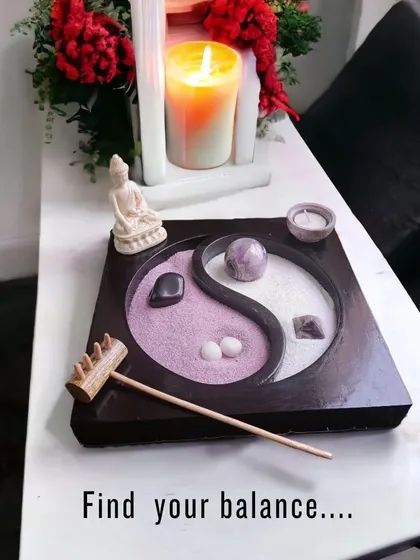 Find your balance with this desktop Zen garden. The Yin Yang design represents harmony, and raking the dual-colored sand around the amethyst crystal is a simple, meditative practice to center your thoughts.