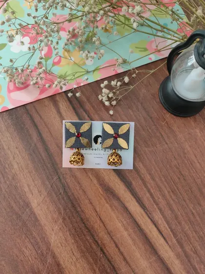 My gotapatti earrings are a festive favorite. These square fabric studs feature golden gotapatti work and a small jhumki drop, available in brown, green, and grey.