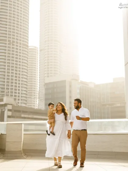 A family walk against the Mumbai skyline. An urban outdoor shoot can be just as beautiful, capturing your family in the city you call home.